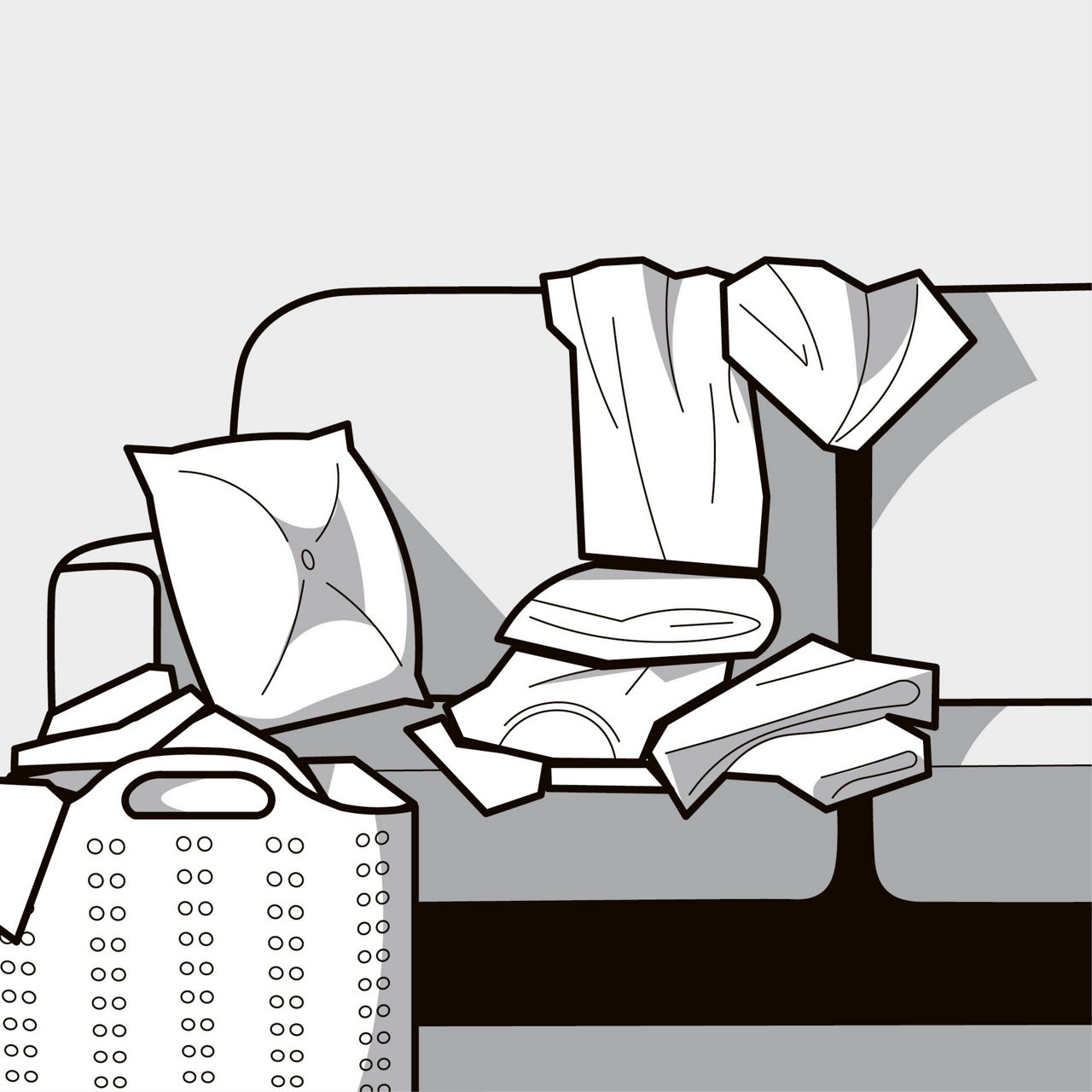 ソファに取り込んだ洗濯物の山